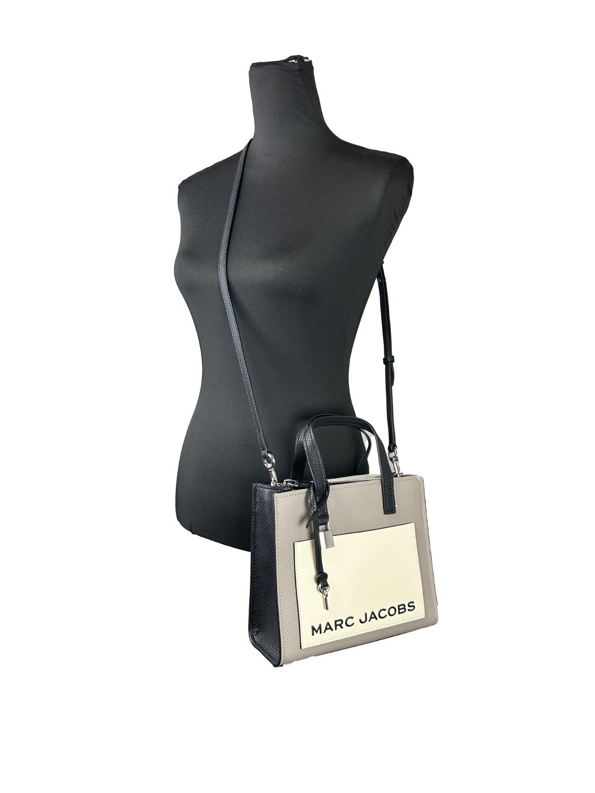 This Mini Crossbody Tote Bag by Marc Jacobs for women in faux patent leather silver features an jet-set Faux Patent Leather Mini Crossbody Tote Bag design with a secure zipper, ample , and jet-set crossbody-strap, adjustable-strap & detachable-strap.