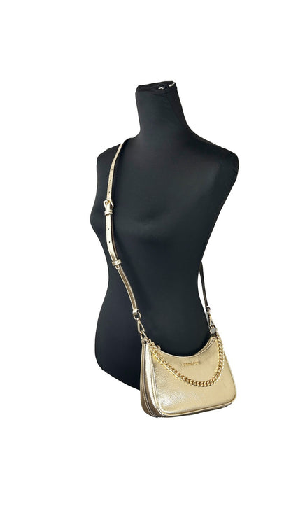 Small Crossbody Travel Handbag by Michael Kors for women in lurex & polyester gold features a transformative sophistication silhouette, showcasing a secure zipper, ample , and versatile crossbody-strap, adjustable-strap, detachable-strap & handle for a transformative sophistication look.