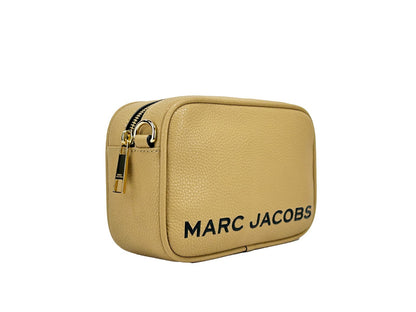 Crossbody Camera Handbag by Marc Jacobs for women in leather gold features a transformative elegance silhouette, showcasing a secure zipper, organized cardholder, and versatile crossbody-strap, adjustable-strap & detachable-strap for a transformative elegance look.