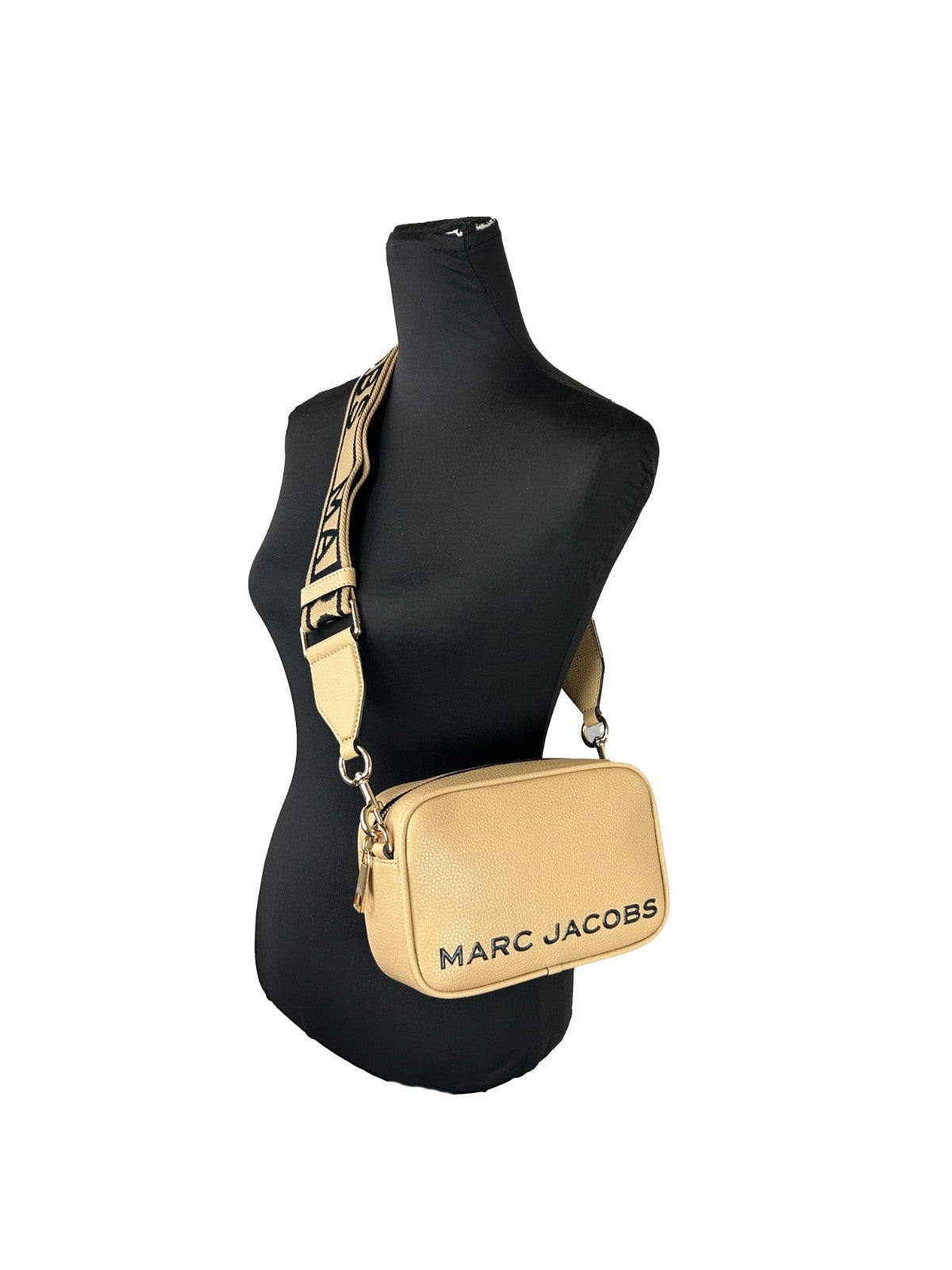 Crossbody Camera Handbag by Marc Jacobs for women in leather gold features a transformative elegance silhouette, showcasing a secure zipper, organized cardholder, and versatile crossbody-strap, adjustable-strap & detachable-strap for a transformative elegance look.