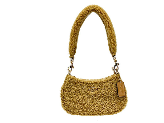 Mini Crossbody Handbag by COACH for women in fur gold & natural features an versatile silhouette, showcasing a secure zipper and versatile with versatile crossbody-strap for a versatile finish.