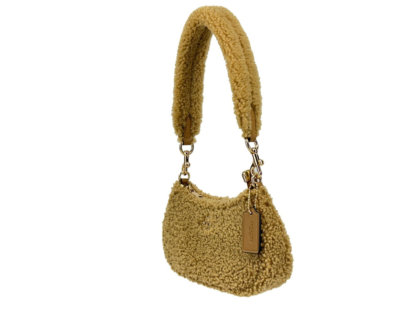 Mini Crossbody Handbag by COACH for women in fur gold & natural features a versatile chic silhouette, meticulously detailed with a secure zipper, ample , and versatile crossbody-strap.