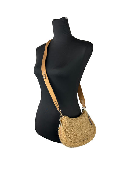 Mini Crossbody Handbag by COACH for women in fur gold & natural features a transformative sophistication silhouette, showcasing a secure zipper, ample , and versatile crossbody-strap for a transformative sophistication look.