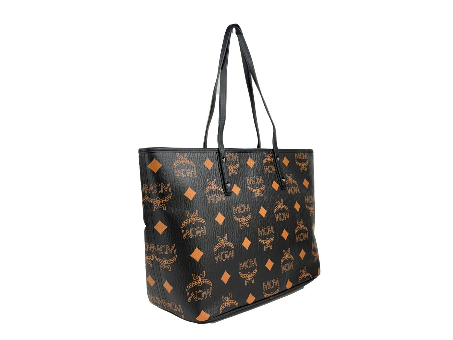 Tote Bag by MCM for women in leather black, silver, signature-print & print showcases a statuesque Aren Leather Tote Bag design, featuring a secure , ample , and versatile for a statuesque finish.