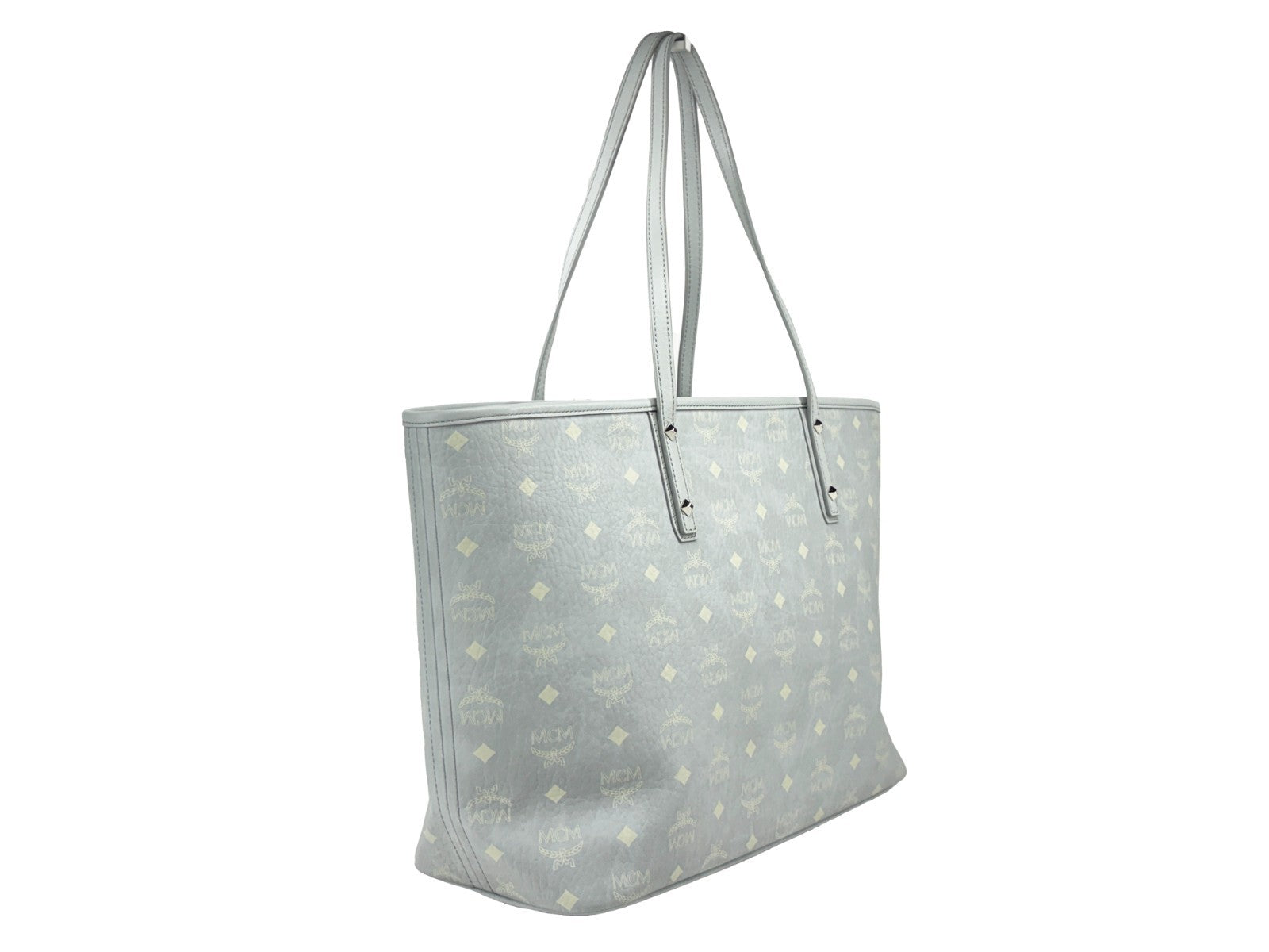 This Tote Bag by MCM for women in leather gray, silver, signature-print & print features an jet-set Aren Leather Tote Bag design with a secure , ample , and jet-set .