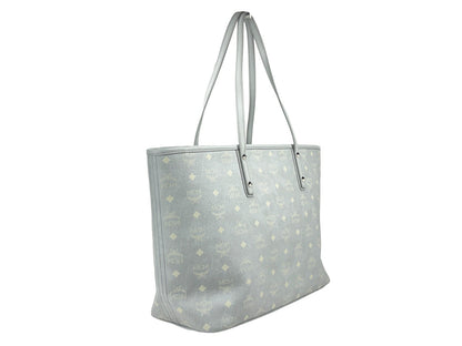 This Tote Bag by MCM for women in leather gray, silver, signature-print & print features an jet-set Aren Leather Tote Bag design with a secure , ample , and jet-set .