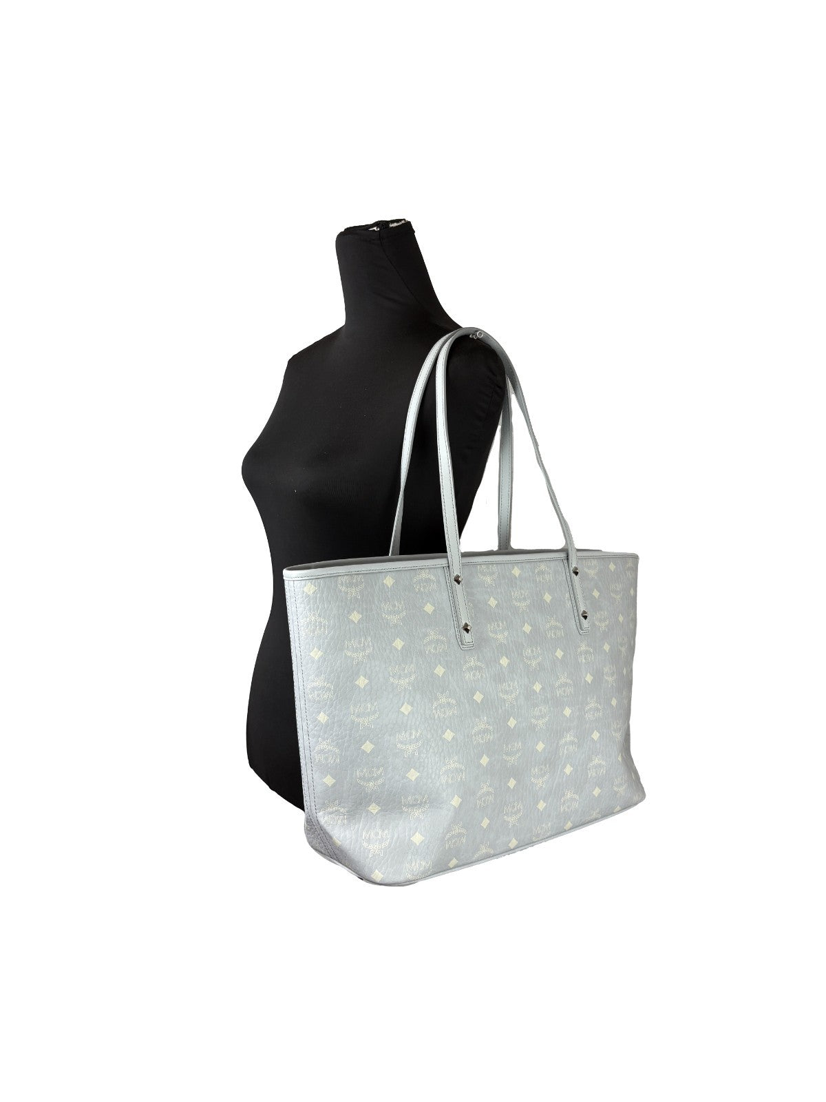 Tote Bag by MCM for women in leather gray, silver, signature-print & print features an jet-setting Aren Leather Tote Bag design with a secure , jet-setting , and versatile for a jet-setting look.