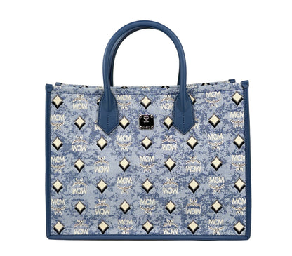 Tote Bag by MCM for women in cotton polyester canvas blue, silver, signature-print & print features an jet-set-ready silhouette, showcasing the Aren Cotton Polyester Canvas Tote Bag design with a secure , ample , and versatile .