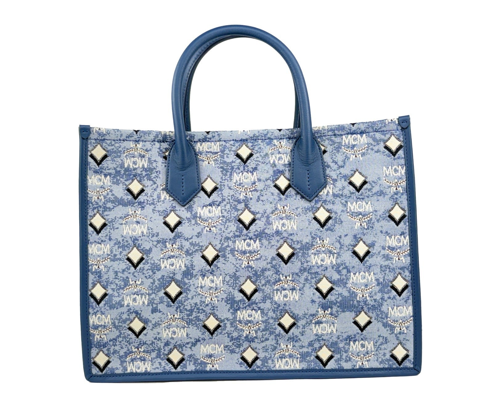 This Tote Bag by MCM for women in cotton polyester canvas blue, silver, signature-print & print features an jet-set Aren Cotton Polyester Canvas Tote Bag design with a secure , ample , and jet-set .