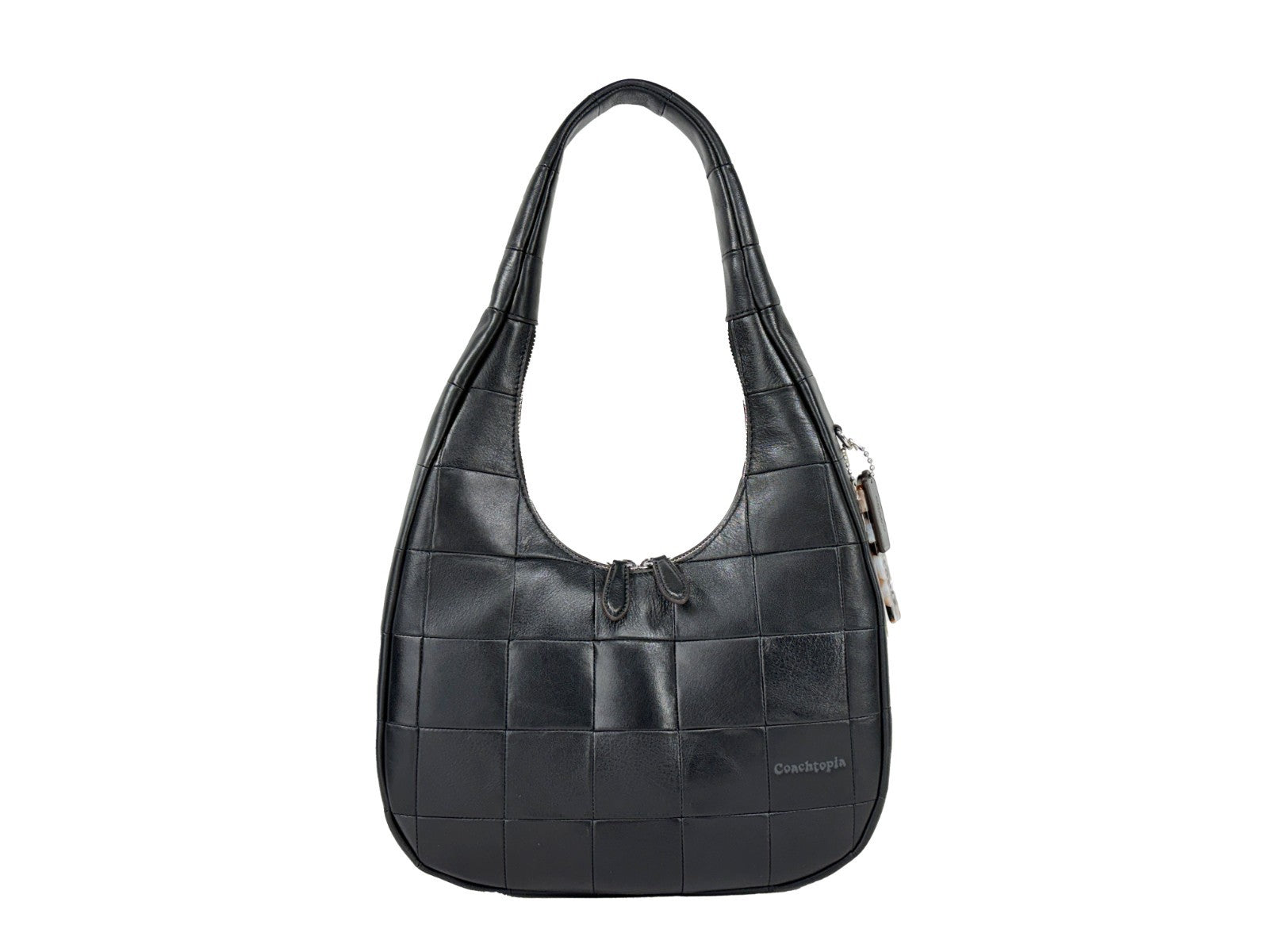 Shoulder Crescent Bag by COACH for women in leather black & silver features a effortless sophistication silhouette, secured by a snap & zipper with ample and versatile shoulder-strap for a effortless sophistication finish.