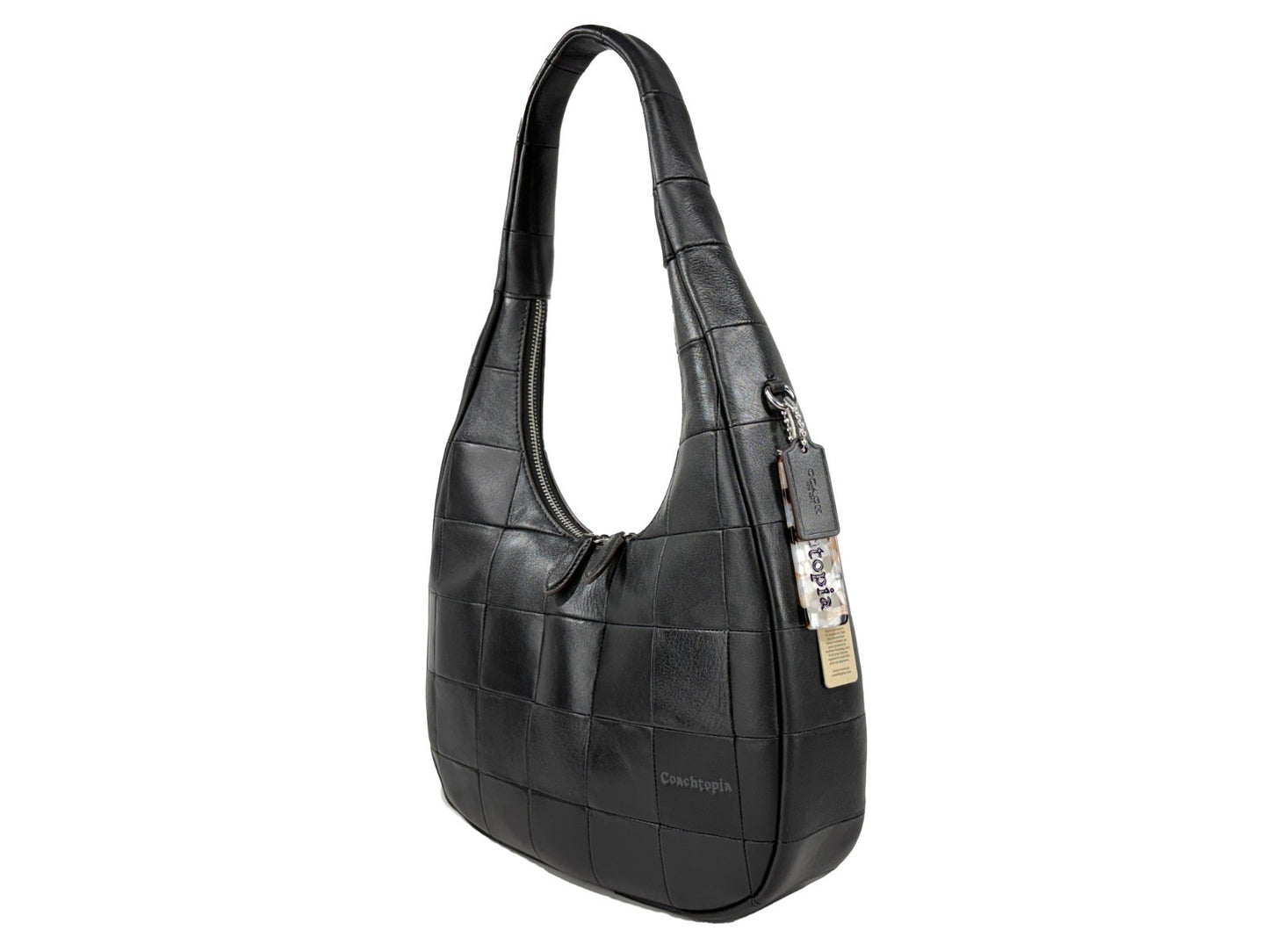 Shoulder Crescent Bag by COACH for women in leather black & silver presents a statuesque silhouette, showcasing a secure snap & zipper and statuesque with versatile shoulder-strap for a sophisticated look.