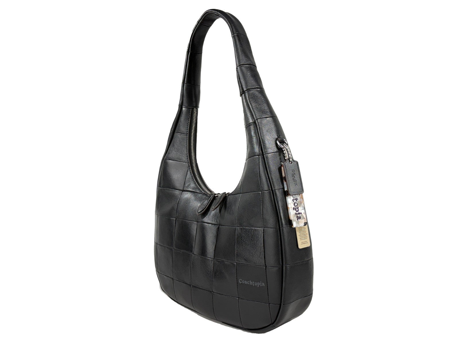 Shoulder Crescent Bag by COACH for women in leather black & silver presents a statuesque silhouette, showcasing a secure snap & zipper and statuesque with versatile shoulder-strap for a sophisticated look.