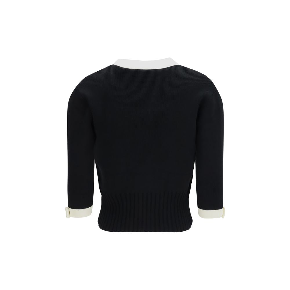 Cardigan by Valentino Garavani for women in cotton bicolour, black, gold & pearl showcases a captivating silhouette, artfully detailed with a captivating and v-neck neckline for a truly sophisticated captivating look.