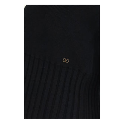 Cardigan by Valentino Garavani for women in cotton bicolour, black, gold & pearl features an impeccable silhouette, showcasing a sophisticated and detail for a truly impeccable finish.