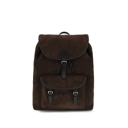 Backpack by Valentino Garavani for men in bos taurus suede calf leather brown, palladium & signature features a utilitarian chic Antibes V Logo Bos Taurus Suede Calf Leather Backpack design with a secure buckle, ample external-pockets, and versatile backpack-strap & adjustable-strap for a utilitarian chic finish.
