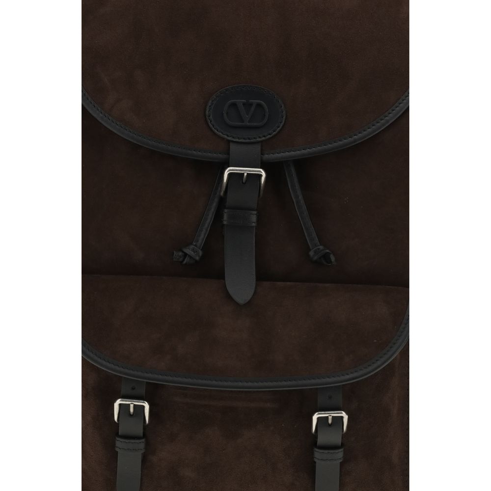 Backpack by Valentino Garavani for men in bos taurus suede calf leather brown, palladium & signature presents a versatile Antibes V Logo Bos Taurus Suede Calf Leather Backpack design, showcasing a secure buckle with ample external-pockets and versatile backpack-strap & adjustable-strap for a versatile finish.