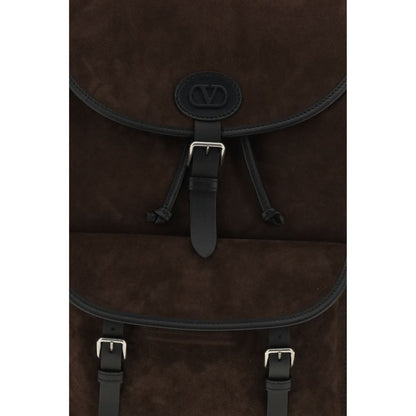Backpack by Valentino Garavani for men in bos taurus suede calf leather brown, palladium & signature presents a versatile Antibes V Logo Bos Taurus Suede Calf Leather Backpack design, showcasing a secure buckle with ample external-pockets and versatile backpack-strap & adjustable-strap for a versatile finish.