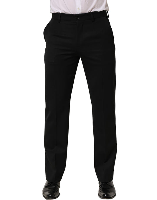 Trousers by Dolce & Gabbana for men in virgin wool black presents a perennial silhouette, meticulously tailored with a tapered-leg cut, long finish, and an elegant .