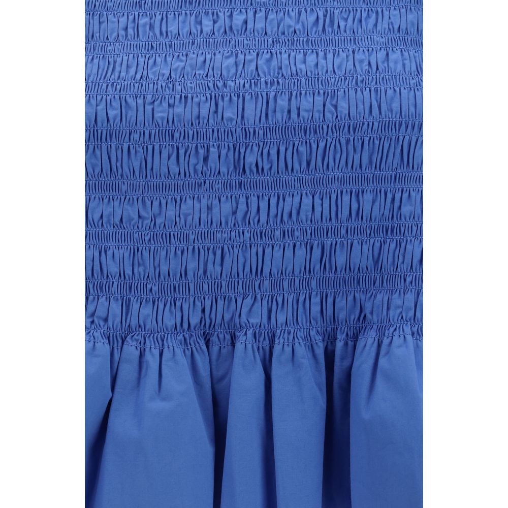 Blouse by Ganni for women in stretch cotton blue showcases a sleek silhouette, elegantly detailed with a sleek round neckline and for a sleek finish.