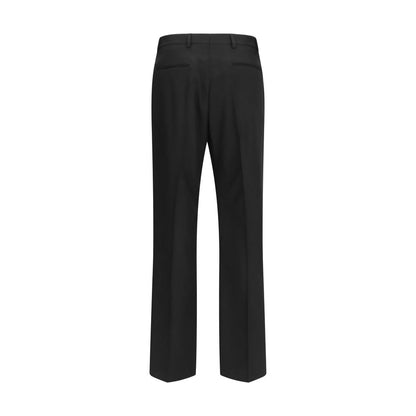 Trousers by Valentino Garavani for men in merino wool black presents a perennial silhouette, meticulously tailored with a regular-fit cut, long finish, and an elegant .