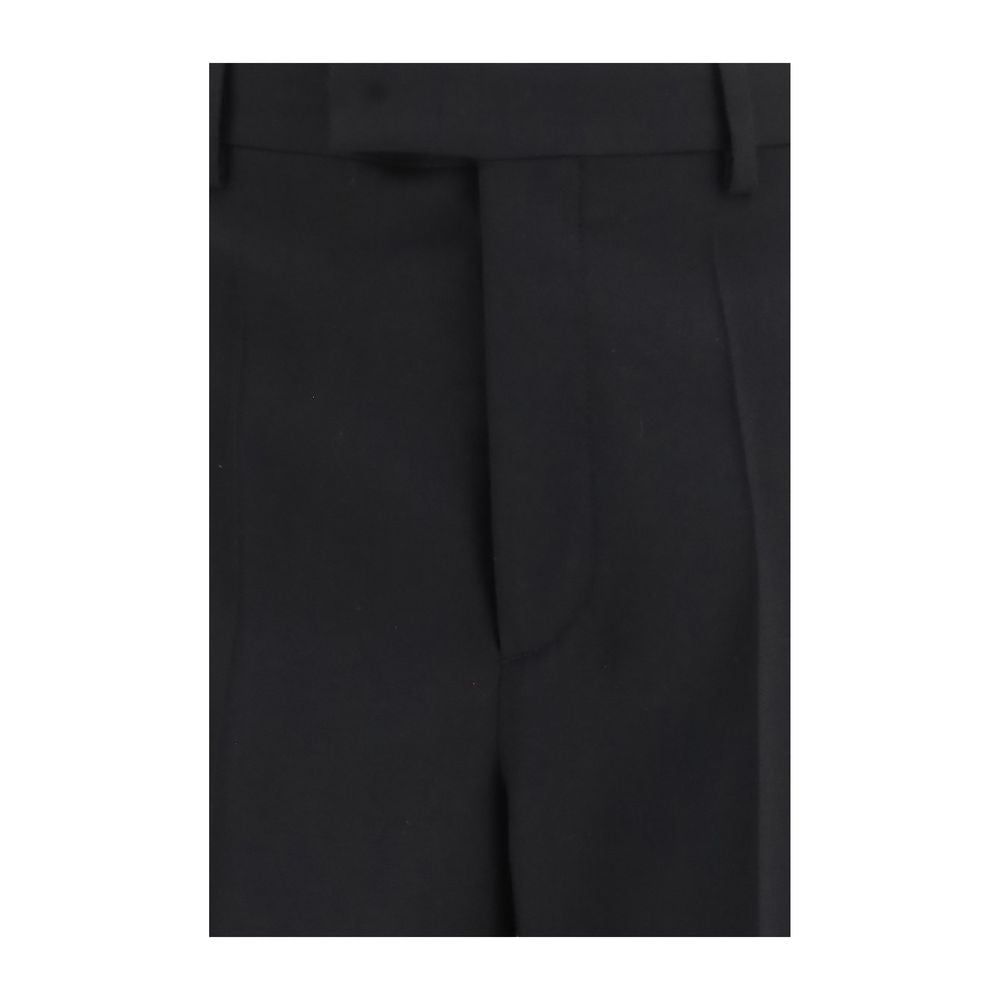 Trousers by Valentino Garavani for men in merino wool black features a artisanal silhouette, showcasing a sophisticated regular-fit with a long and for a artisanal finish.