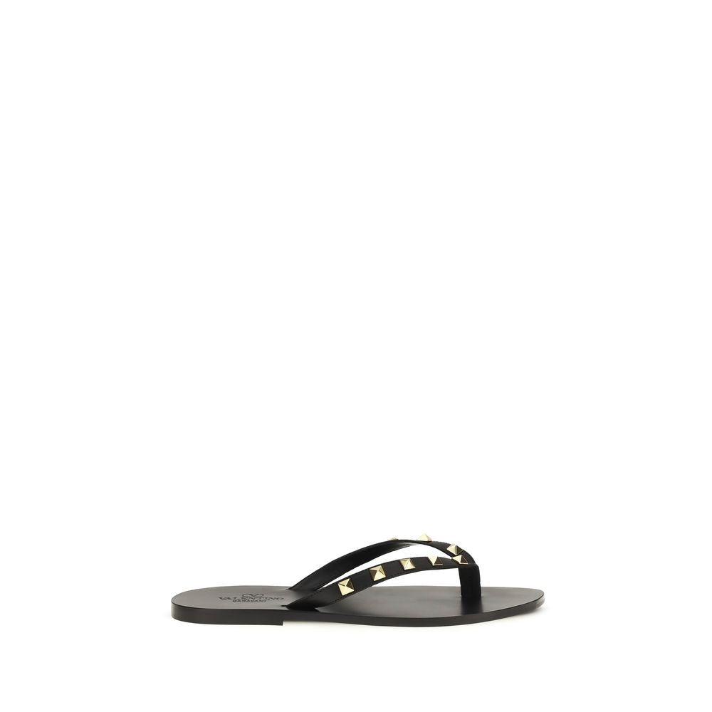 Flip-Flop Thong Sandals by Valentino Garavani for men in bos taurus calfskin leather black presents a sculptural silhouette, showcasing the Rockstud Men's Bos Taurus Calfskin Leather Flip-Flop Thong Sandals design with a sculptural and for a premium look.