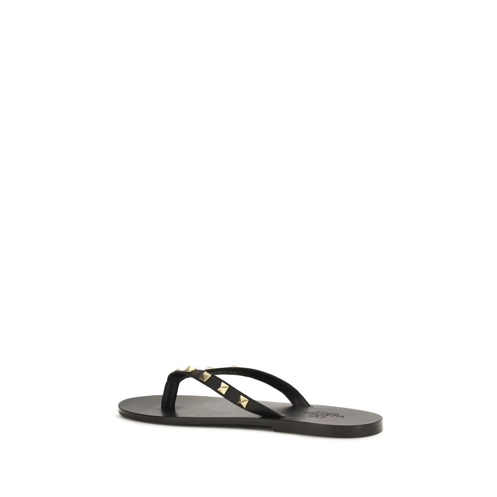 Flip-Flop Thong Sandals by Valentino Garavani for men in bos taurus calfskin leather black features an effortlessly chic silhouette from the Rockstud Men's Bos Taurus Calfskin Leather Flip-Flop Thong Sandals collection, showcasing a effortlessly chic and elegant .