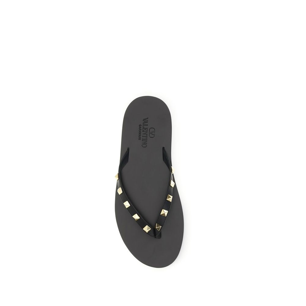 Flip-Flop Thong Sandals by Valentino Garavani for men in bos taurus calfskin leather black features an exquisite silhouette, showcasing the exquisite Rockstud Men's Bos Taurus Calfskin Leather Flip-Flop Thong Sandals with a and .