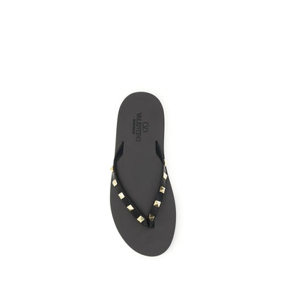 Flip-Flop Thong Sandals by Valentino Garavani for men in bos taurus calfskin leather black features an exquisite silhouette, showcasing the exquisite Rockstud Men's Bos Taurus Calfskin Leather Flip-Flop Thong Sandals with a and .