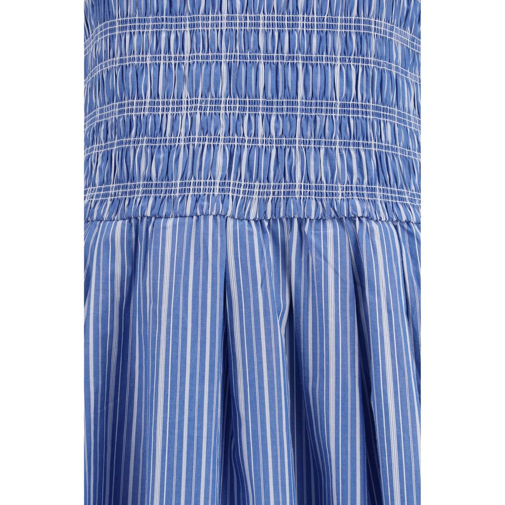 Dress by Ganni for women in cotton blue, patterned & striped showcases a striking silhouette, elegantly detailed with a , refined , and a striking midi knee short for a striking finish.