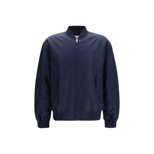 This Bomber Jacket by Valentino Garavani for men in nylon blue & gold exhibits a edgy silhouette, meticulously detailed with functional pockets and a edgy for a edgy finish.