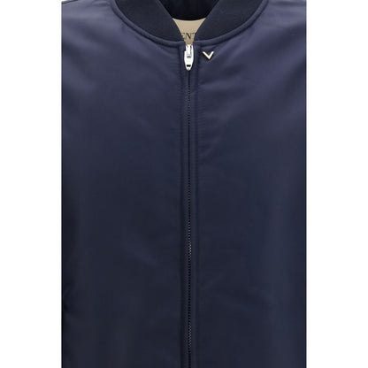 Bomber Jacket by Valentino Garavani for men in nylon blue & gold showcases a bohemian silhouette, artfully detailed with a bohemian and signature pockets for a truly bohemian finish.