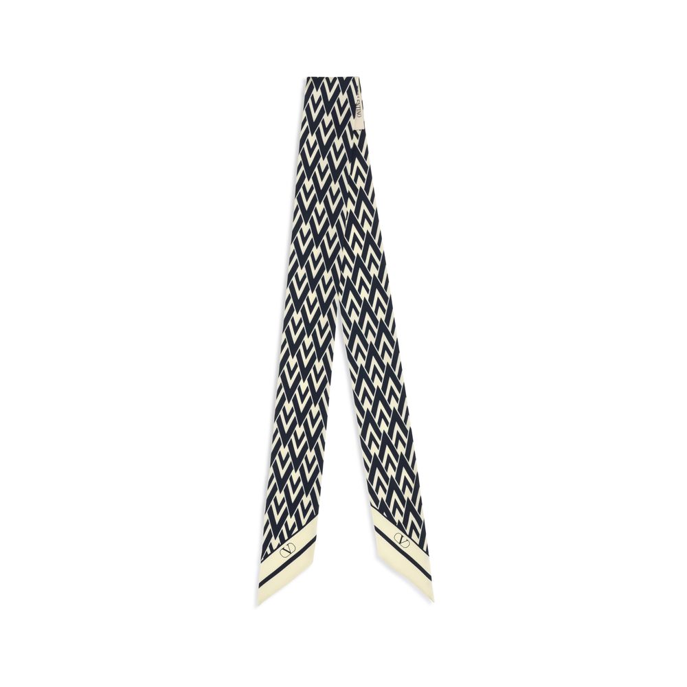 Scarf by Valentino Garavani for women in silk twill blue & print showcases a warm silhouette from the Silk Twill Scarf collection, offering a warm drape that exudes sophisticated luxury.