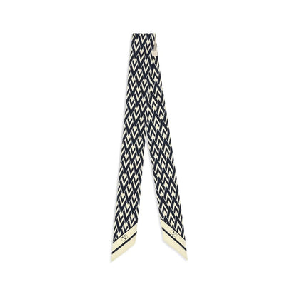 Scarf by Valentino Garavani for women in silk twill blue & print showcases a warm silhouette from the Silk Twill Scarf collection, offering a warm drape that exudes sophisticated luxury.