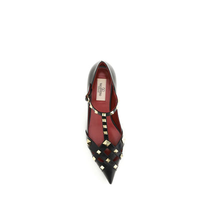 Ballet Flat Shoes by Valentino Garavani for women in goatskin leather black showcases a dynamic silhouette, artfully capturing Women's Goatskin Leather Ballet Flat Shoes through its distinctive and elegant almond toe style.