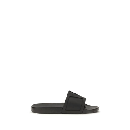 Flat Slider Sandals by Valentino Garavani for men in rubber black & signature features an exquisite silhouette, showcasing the exquisite V Logo Men's Rubber Flat Slider Sandals with a flat and .