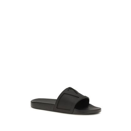 Flat Slider Sandals by Valentino Garavani for men in rubber black & signature features an architectural design from the V Logo Men's Rubber Flat Slider Sandals collection, defined by a architectural flat and for a architectural finish.