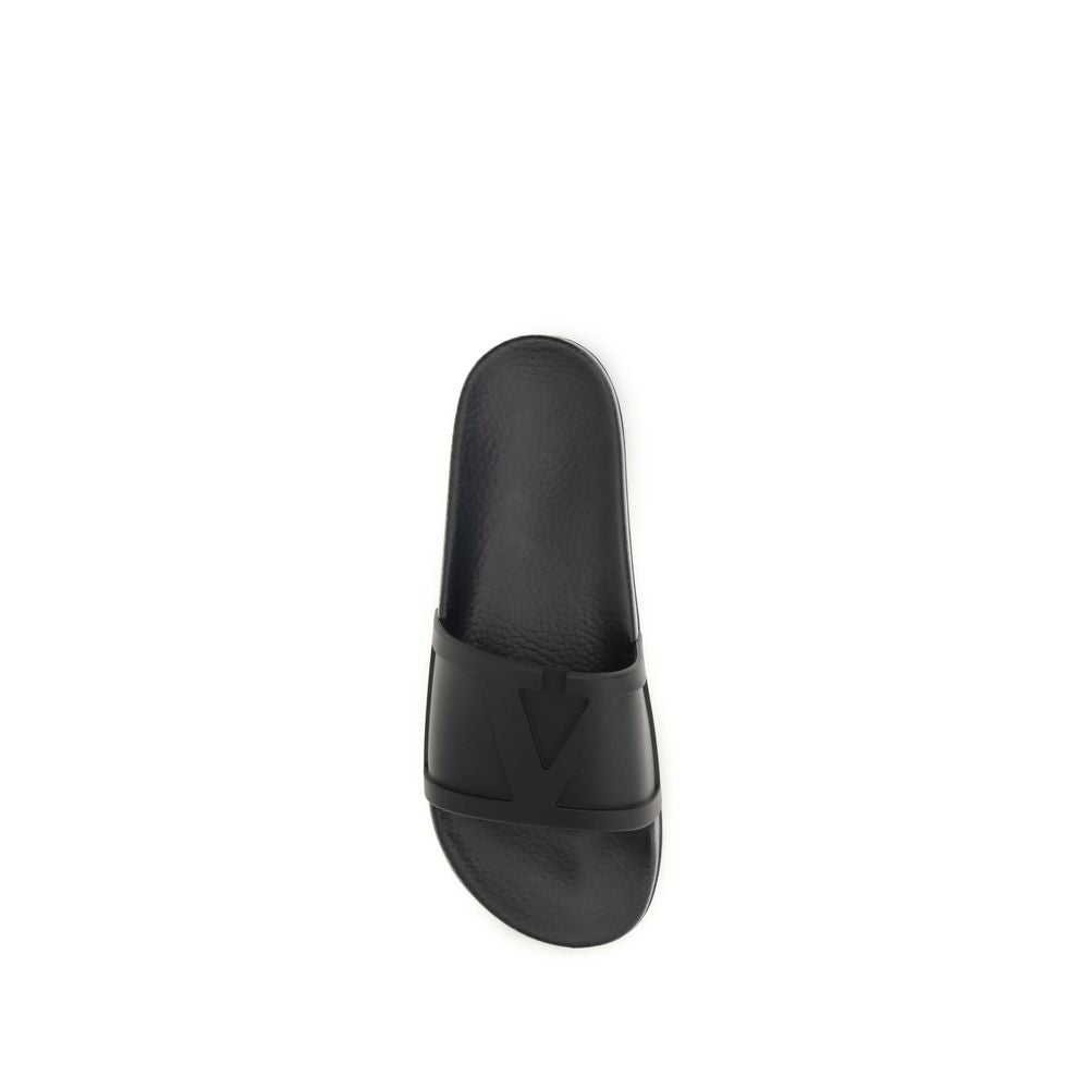 Flat Slider Sandals by Valentino Garavani for men in rubber black & signature features an architectural design from the V Logo Men's Rubber Flat Slider Sandals collection, defined by a architectural flat and for a architectural finish.