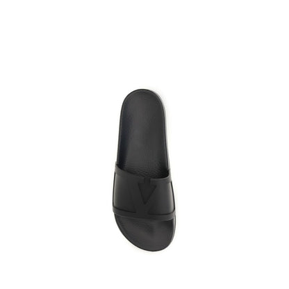 Flat Slider Sandals by Valentino Garavani for men in rubber black & signature features an architectural design from the V Logo Men's Rubber Flat Slider Sandals collection, defined by a architectural flat and for a architectural finish.