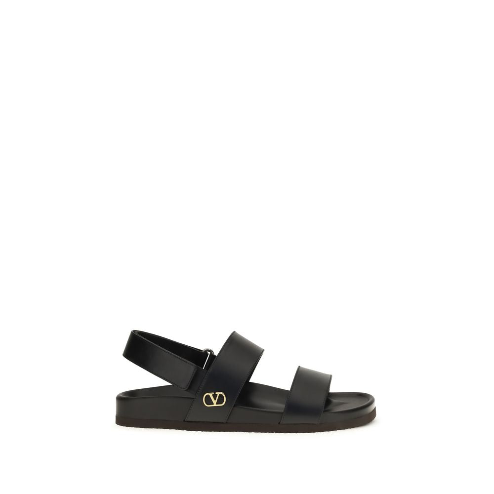 Flat Sandals by Valentino Garavani for men in bos taurus calfskin leather black, gold & signature features an effortlessly chic silhouette from the V Logo Men's Bos Taurus Calfskin Leather Flat Sandals collection, showcasing a effortlessly chic flat and elegant .
