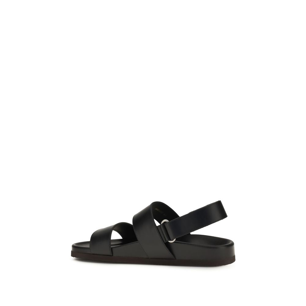 Flat Sandals by Valentino Garavani for men in bos taurus calfskin leather black, gold & signature features an statuesque V Logo Men's Bos Taurus Calfskin Leather Flat Sandals silhouette with a refined flat and elegant .