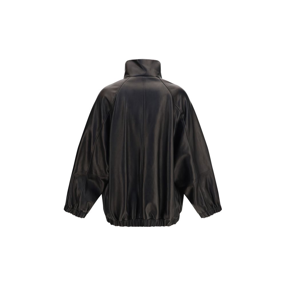 Jacket by Brunello Cucinelli for women in leather black showcases a contemporary silhouette, detailed with a contemporary high-collar neckline and premium pockets for a sophisticated finish.