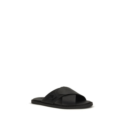 Flat Slider Sandals by Fendi for men in bos taurus calfskin leather black features an effortlessly chic silhouette from the Men's Bos Taurus Calfskin Leather Flat Slider Sandals collection, showcasing a effortlessly chic flat and elegant round toe style.