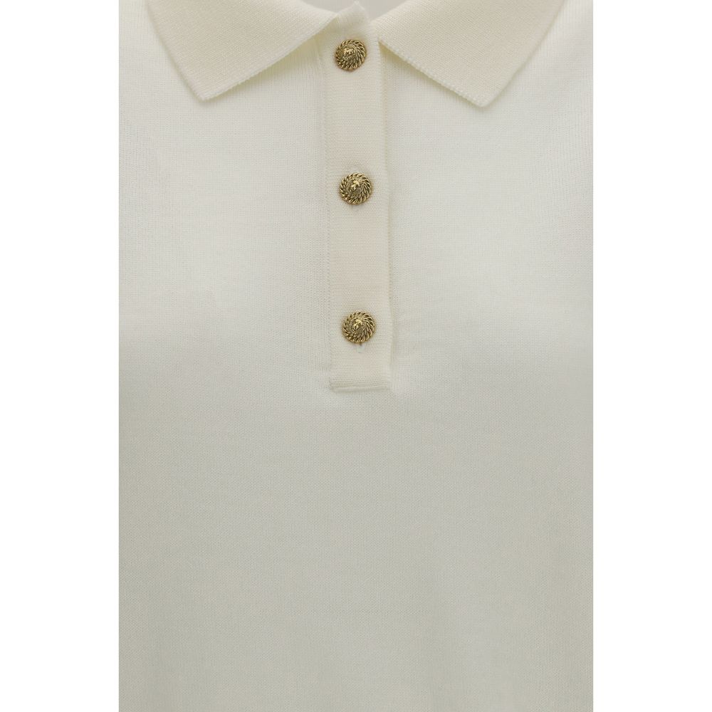 This Polo Shirt by Balmain for women in merino wool gold, white & patterned presents a flawless silhouette, showcasing flawless detailing and a refined for a truly flawless aesthetic.