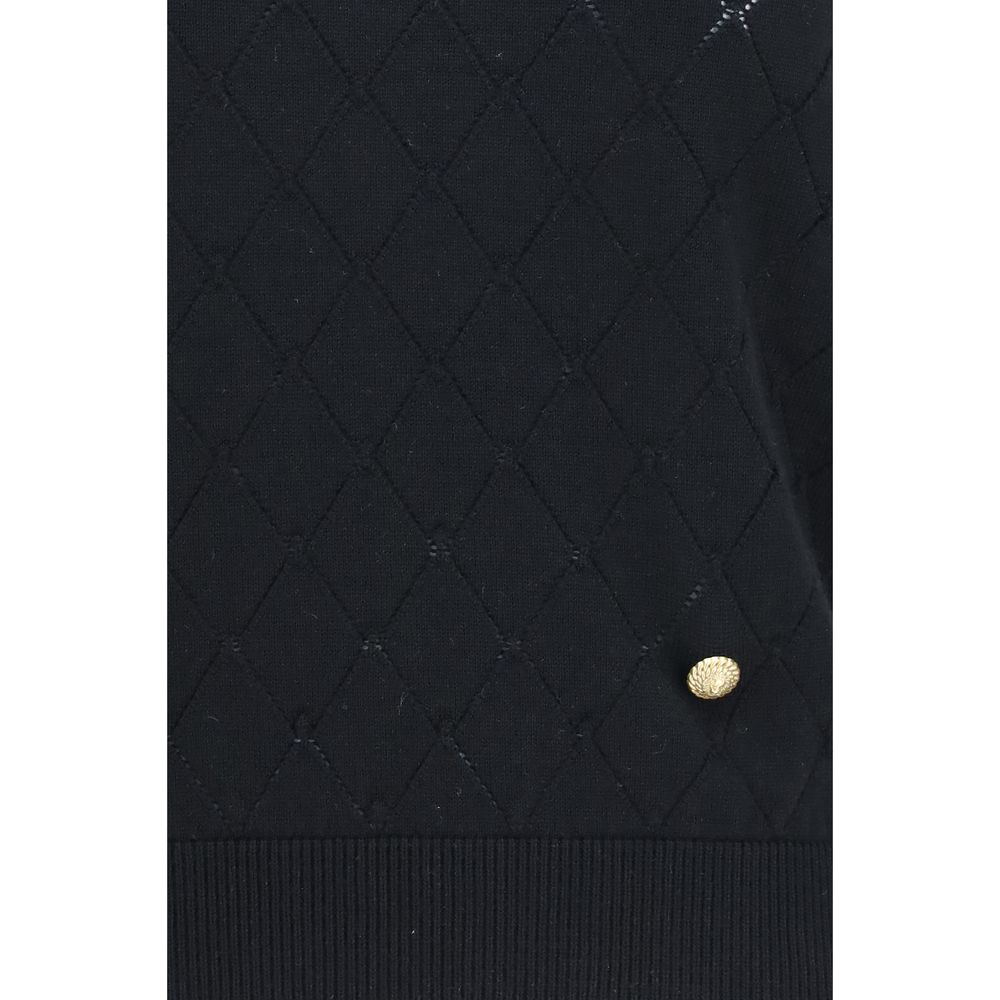 T-Shirt by Balmain for women in merino wool black & gold showcases a unassuming silhouette, artfully detailed with a refined and unassuming for a sophisticated, contemporary look.