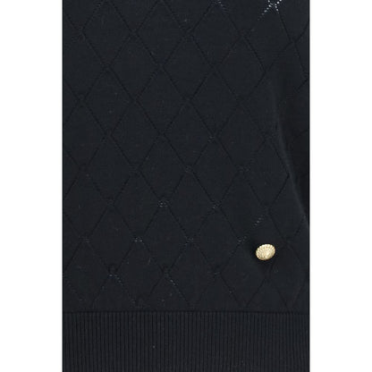 T-Shirt by Balmain for women in merino wool black & gold showcases a unassuming silhouette, artfully detailed with a refined and unassuming for a sophisticated, contemporary look.