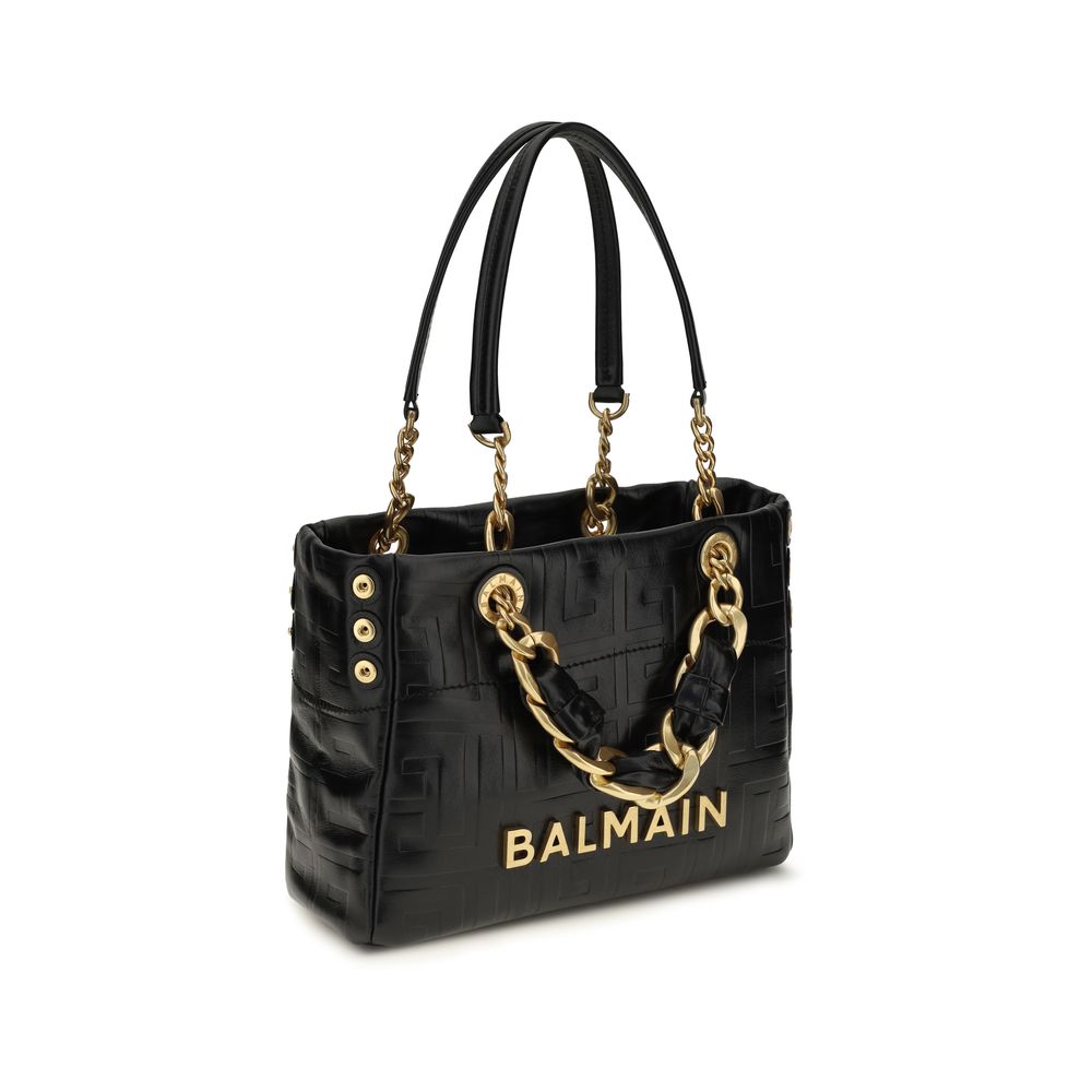Small Tote Shoulder Bag by Balmain for women in embossed bos taurus calf leather black, gold & signature features a enviable silhouette, showcasing a secure snap, zipper, hook & button, ample , and enviable adjustable-strap & handle for a enviable finish.