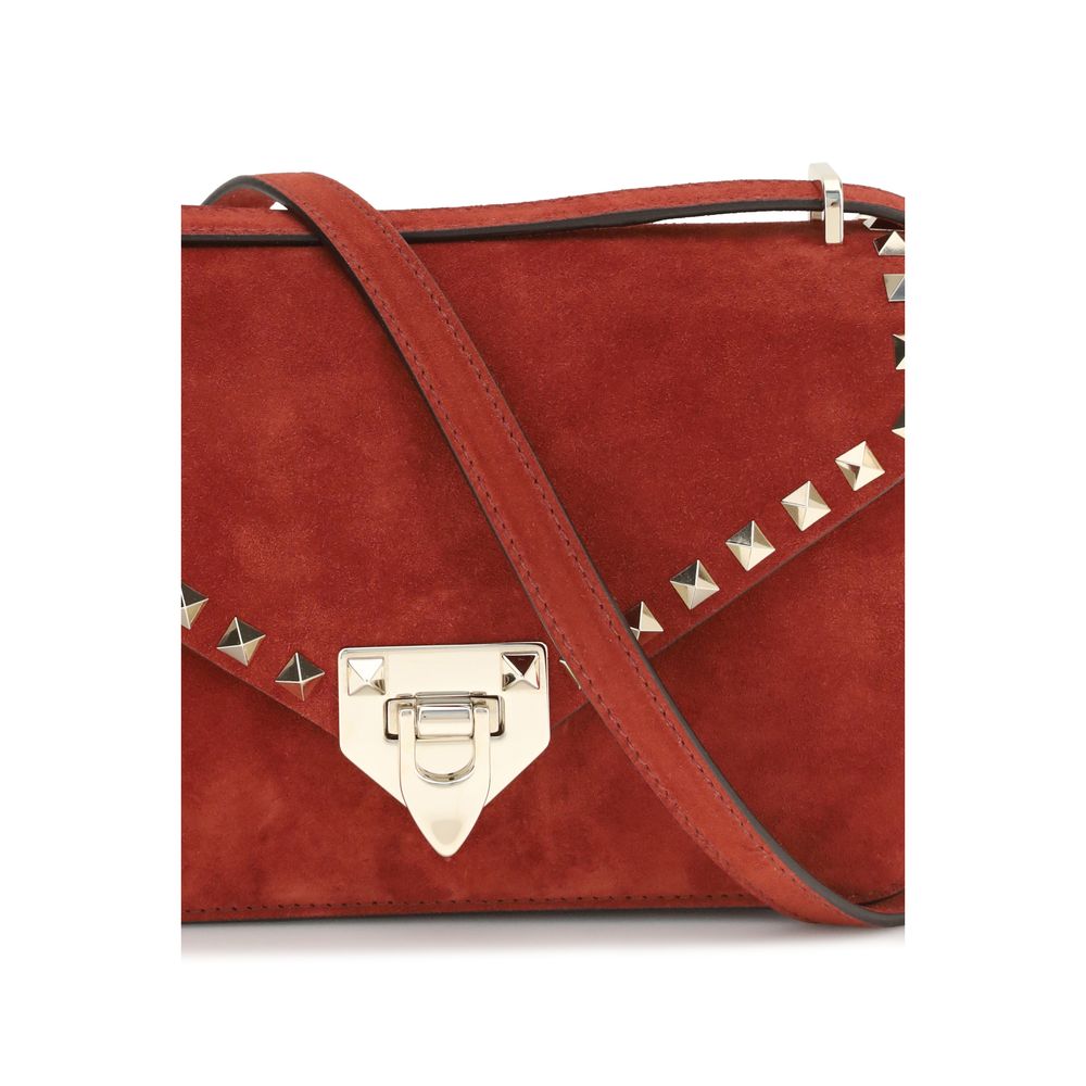 Mini Shoulder Bag by Valentino Garavani for women in nappa & suede leather multicolor & signature showcases a enviable silhouette, artfully detailed with a secure zipper & hook, organized single-compartment, and versatile shoulder-strap & adjustable-strap for a enviable look.
