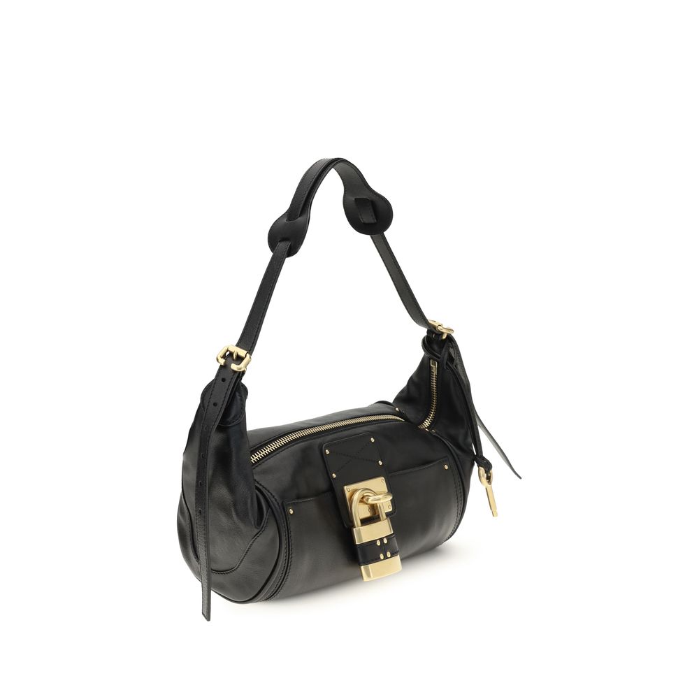 Small Shoulder Bag by Chloé for women in bos taurus calf leather black & signature features an effortlessly chic silhouette with a secure zipper & buckle, ample , and versatile shoulder-strap for effortlessly chic everyday luxury.