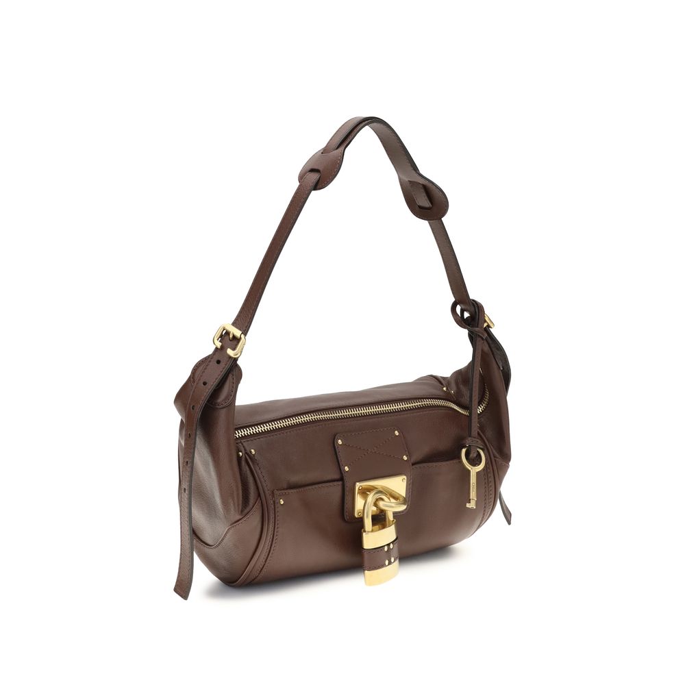 Small Shoulder Bag by Chloé for women in bos taurus calf leather brown & signature features a effortless sophistication silhouette, secured by a zipper & buckle with ample and versatile shoulder-strap for a effortless sophistication finish.